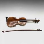 A 20th century one quarter size violin with two piece back, LOB 10.5", together with associated