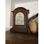 A German mahogany and inlaid musical mantel clock, circa 1900, the arched case with twin column