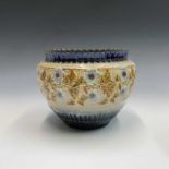 A Doulton Lambeth stoneware jardiniere with a broad band of applied and painted anemones. Height