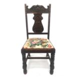 A Victorian oak side chair, the back carved with a monogram, the vase-shaped splat decorated with