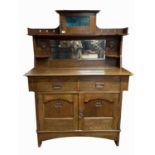 An Arts and Crafts oak mirror backed sideboard, height 166cm, width 129cm.