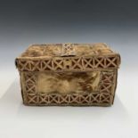 A late 19th Century deerskin box, possibly North American, with pierced leather strapwork