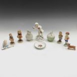 A Beswick figure, 'Christopher Robin', two Royal Worcester figures, 'December' and 'My Pet' together