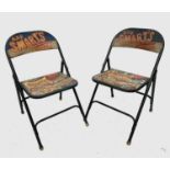 A pair of painted metal folding chairs, 'Billy Smart's Circus'.