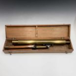 A brass telescope, circa 1900, complete with folding brass mounted tripod, length 60cm, mahogany