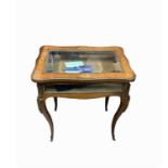 A French Louis XV style rosewood inlaid display table, late 19th century, the glazed hinged top with