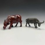 A Chinese bronze sculpture of a buffalo, height 9cm, together with a carved wood buffalo, signed