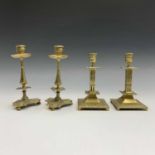 A pair of 19th century cast brass candlesticks, with tapered stems and trefoil bases, height 22cm,