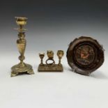 A Victorian brass candlestick, the stem cast as an owl, with inset glass eyes, height 20cm, together