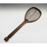 An early 20th century fish tail tennis racquet, indistinct maker's mark, overall length 69cm.