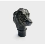A bronze walking stick handle cast as a dog's head. Height 7cm.