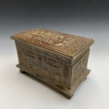 An African carved wood box with figural and geometric decoration. Height 22cm, width 35cm, depth