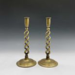 A pair of late Victorian brass barley twist candle sticks. Height 29cm.