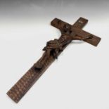 A Continental carved walnut crucifix, circa 1900, height 63cm.