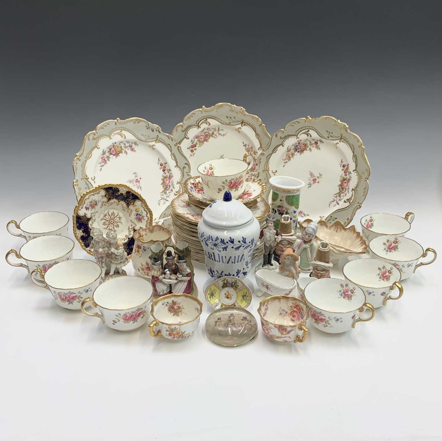 A miniature Dresden style cup and saucer of quatrefoil outline, together with a quantity of other