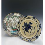 An art pottery plate, painted in underglaze blue with Pegasus, diameter 29.5cm, and one other