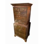 A George III style mahogany chest on chest, of small proportions, with two short and six long