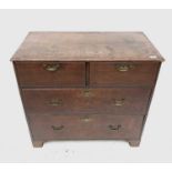 A George III oak chest of drawers, with two short and three long drawers on bracket feet, height