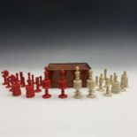 A late 19th century turned bone chess set, barleycorn pattern, in natural and red stained finish and