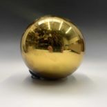 A gold mirrored glass witch ball. Diameter 16.5cm overall.