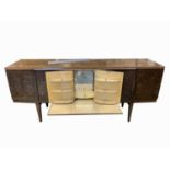 A mid-century Beautilty cocktail sideboard, with walnut finish, fitted a patent pullout central