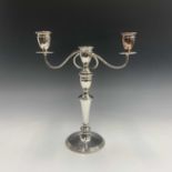 A pair of silver plated three branch candelabra. Height 37cm.Condition report: Two 2mm notches in