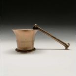 A brass mortar and pestle. Height of mortar 9cm, length of pestle 19cm.