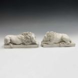 A pair of composition sculptures, 'Chatsworth Lions', length 22cm.