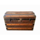 A metal bound wooden dome top steamer trunk, height 51cm, width 76cm, depth 44cm, together with a