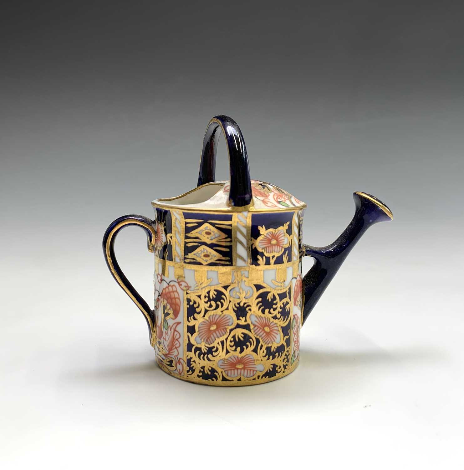 A Royal Crown Derby model of a watering can. Height 7cm. - Image 3 of 3