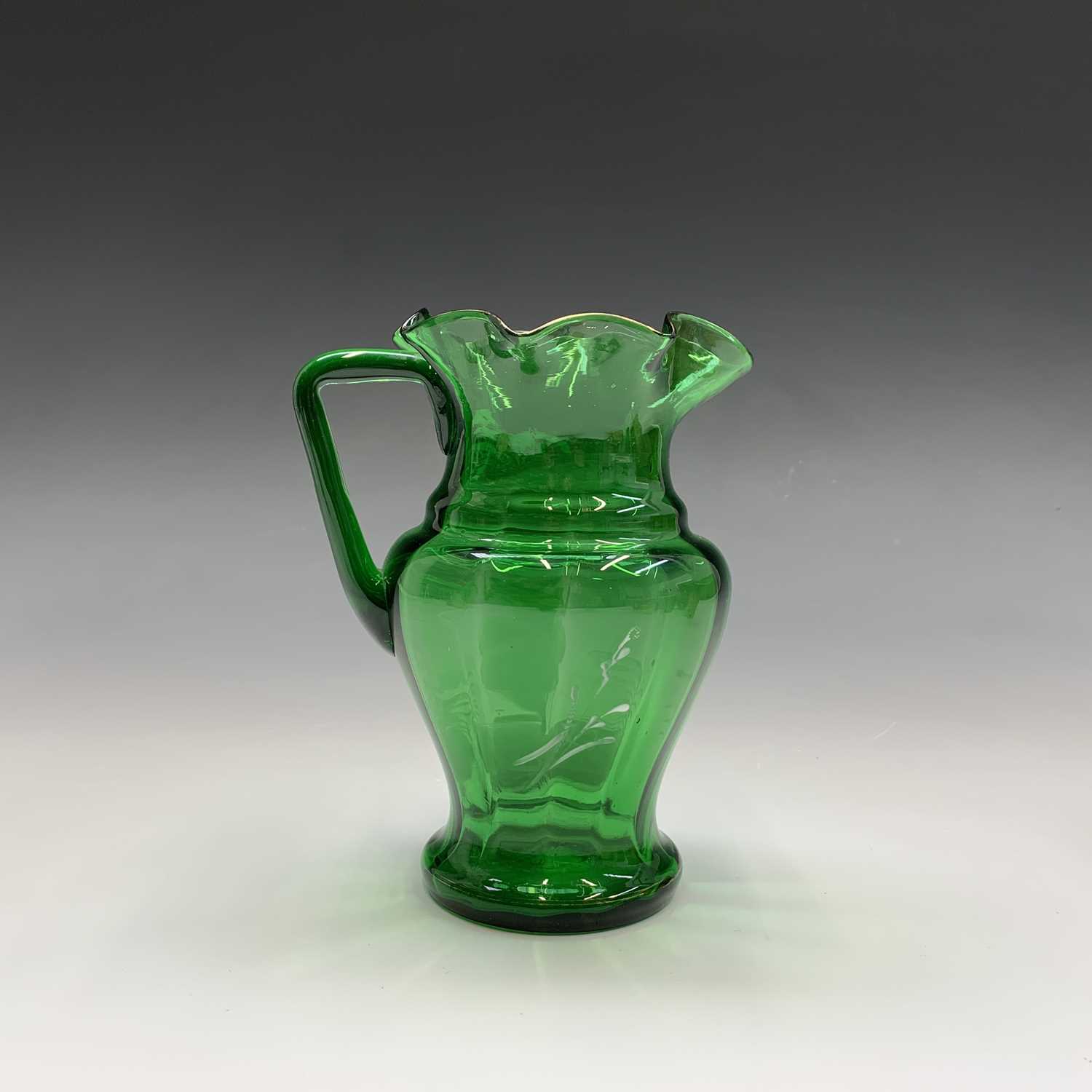 A Mary Gregory green glass jug, late 19th century, enamelled with a figure, height 17cm, together - Image 19 of 20