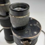 A pair of WWII German Kriegsmarine 7x50 Leitz beh binoculars, stamped with the Reichsadler, and