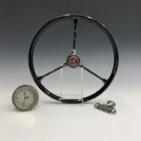 A vintage three spoke car steering wheel, the central button badge stamped RRR, diameter 38cm,