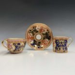 A Spode porcelain trio, circa 1810, painted in iron red, blue and gilt with the Dollar pattern,