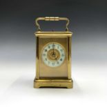 A French repeating brass cased carriage clock, late 19th century, with cream enamel chapter ring,