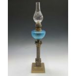 A Victorian brass Corinthian column oil lamp with a turquoise glass reservoir. Overall height