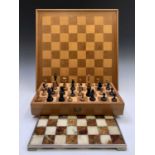A Staunton type boxwood and ebony chess set, the Kings height 7.5cm, together with a similar set, in