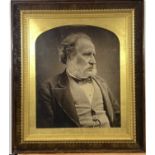 A gilt and rosewood frame with a photograph of an elderly gentleman, frame size 62.5 x 55cm