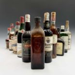 A selection of vintage bottles of Gin, fortified wine and other spirits.Condition report: The