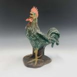 A 20th century continental pottery model of a cockerel, monogram to base. Height 34cm.