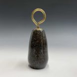 A Cornish serpentine door stop with brass loop handle. Height 22.5cm.Condition report: There are