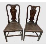 A pair late 18th century Welsh oak Georgian music chairs, intricately carved with Pan and Psyche,