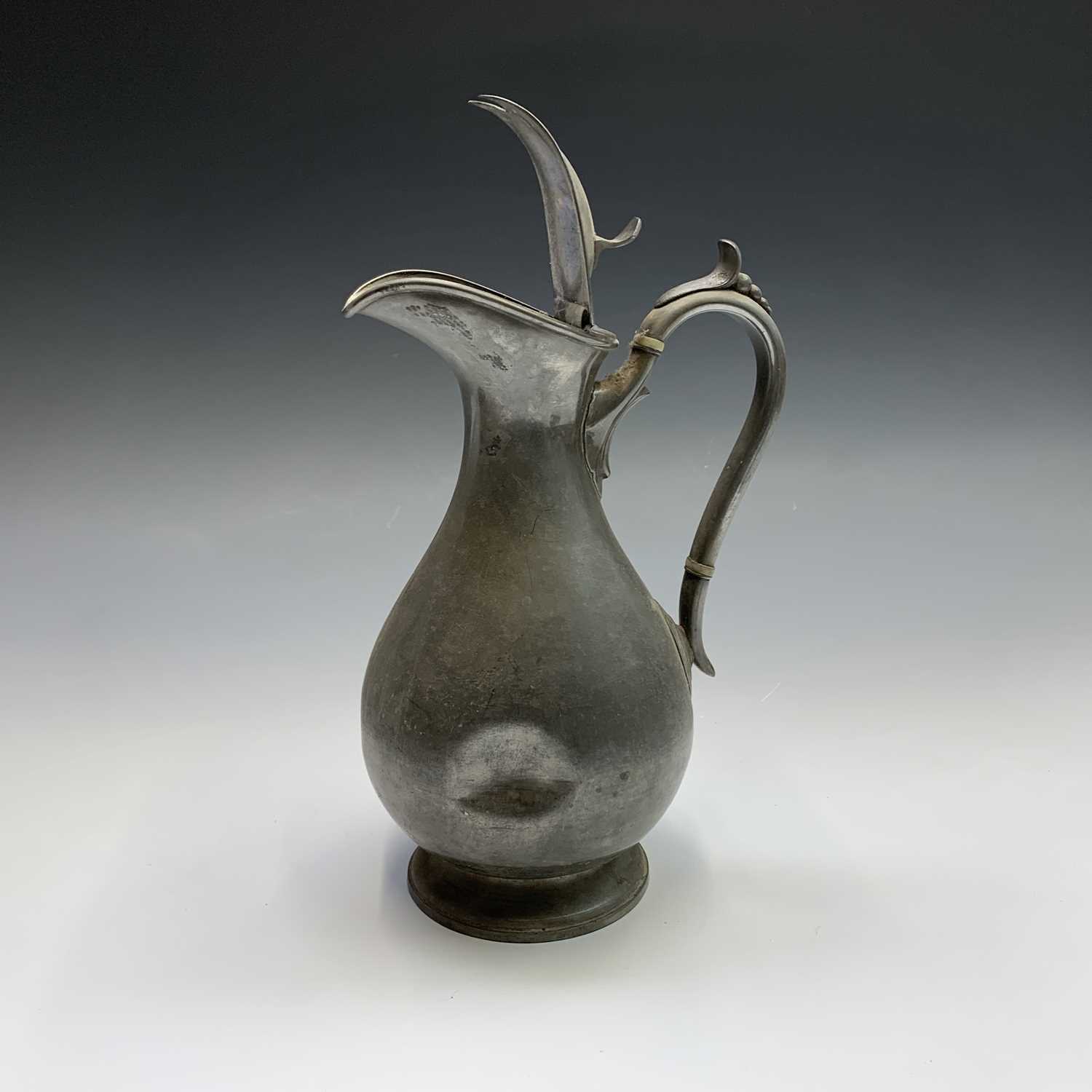 A 19th century pewter flagon with hinged cover, engraved with tulips and initialled G.A.K. and dated - Image 7 of 20