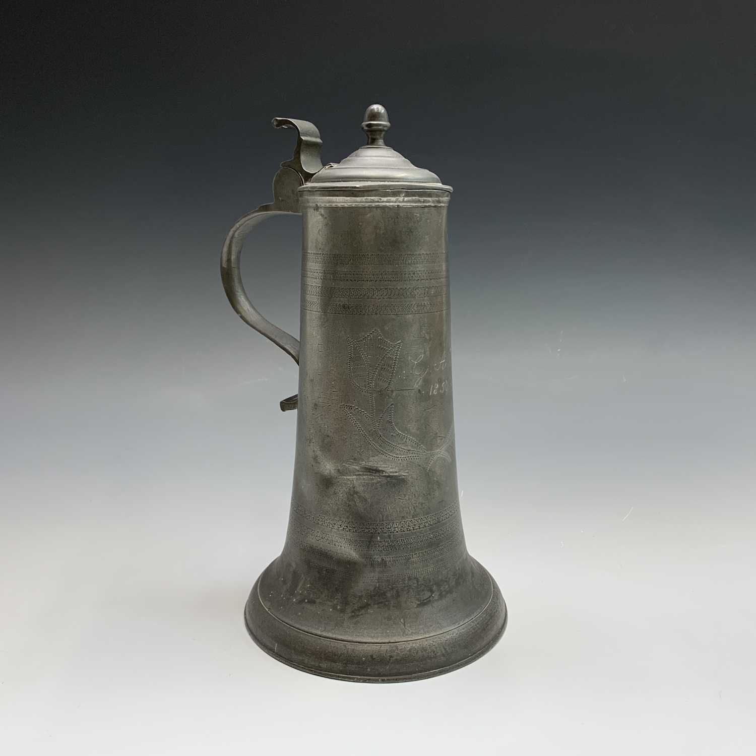 A 19th century pewter flagon with hinged cover, engraved with tulips and initialled G.A.K. and dated - Image 2 of 20