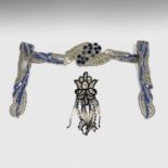 An early 20th century heavily beaded belt in shades of silver and blue, length 100cm, together