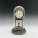 A German brass 400 day anniversary clock, on fluted column supports, with German and US patent