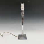 An Art Deco chrome table lamp, with square section column on a low square stepped base, height