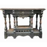 A Victorian carved oak hall table, with a single central drawer on turned supports, height 107cm,