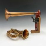 A vintage ships copper horn, length 40cm, on wooden stand, together with a copper and brass bugle