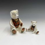 Two Royal Crown Derby teddy bear paperweights, 'Debonair Bear' and one other. Tallest 12cm high.